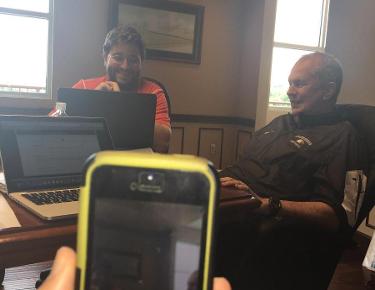 Wide receivers coach Brock Pursley mans Periscope as head coach Ken Sparks and Voice of the Eagles Adam Cavalier participate in the SAC's Digital Media Day.